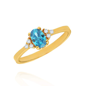 Złoty pierścionek owalna błękitna cyrkonia 585 białe cyrkonie