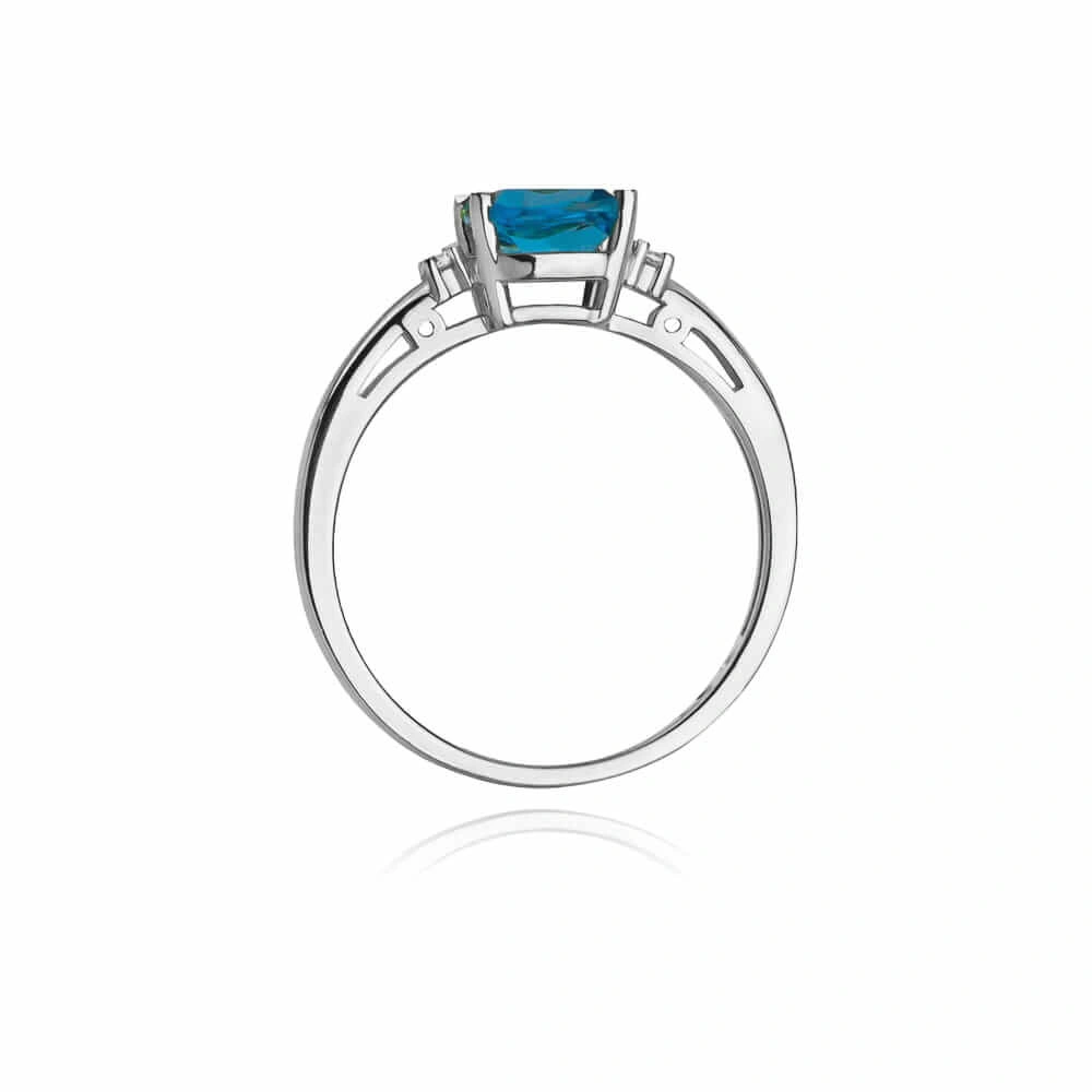Złoty pierścionek 585 topaz 0,70 ct z diamentami 0,03 ct białe złoto
