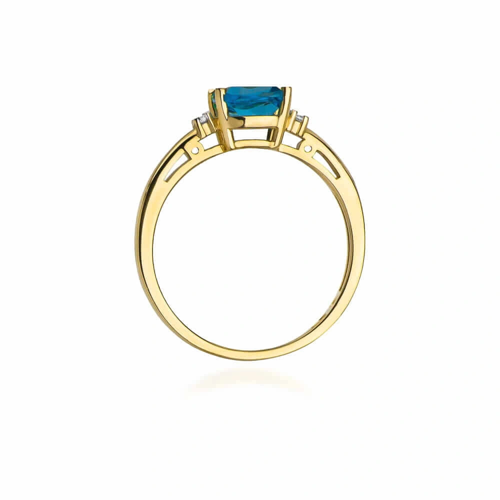 Złoty pierścionek 585 topaz 0,70 ct z diamentami 0,03 ct